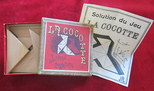 vintage puzzle, antique game, French puzzle, wooden brain teaser, La Cocotte game, casse-tête, dissection puzzle, 19th century toy, vintage tangram, old French game, collectible puzzle, retro brain game, historical toy, vintage boxed game, rare puzzle game, nostalgic toy, early 1900s game, antique wood puzzle, Art Nouveau puzzle, classic logic game