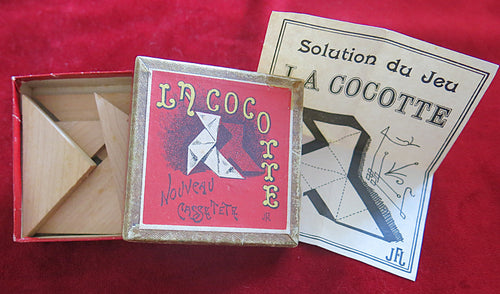 vintage puzzle, antique game, French puzzle, wooden brain teaser, La Cocotte game, casse-tête, dissection puzzle, 19th century toy, vintage tangram, old French game, collectible puzzle, retro brain game, historical toy, vintage boxed game, rare puzzle game, nostalgic toy, early 1900s game, antique wood puzzle, Art Nouveau puzzle, classic logic game