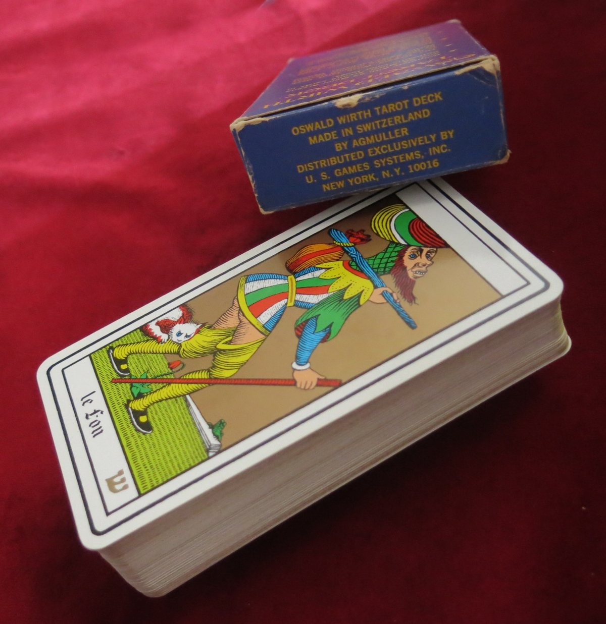 The Fool card beside the box imprint stating made in Switzerland by AGMuller and distributed by U.S. Games Systems in New York